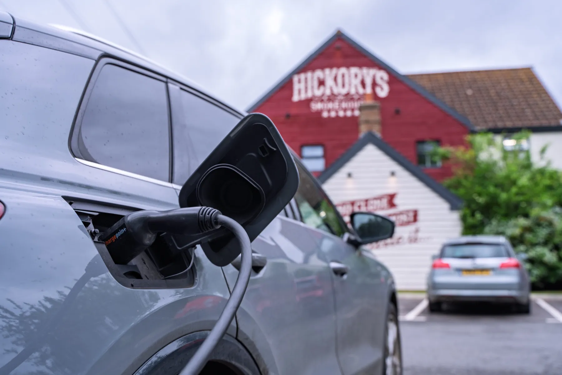 EV charging at Hickory's Smokehouse, with the smokehouse behind