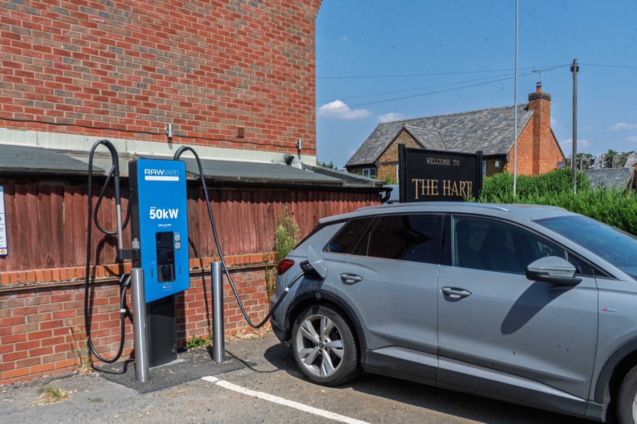 RAW Rapid charger with car charging outside The Hart, Northampton