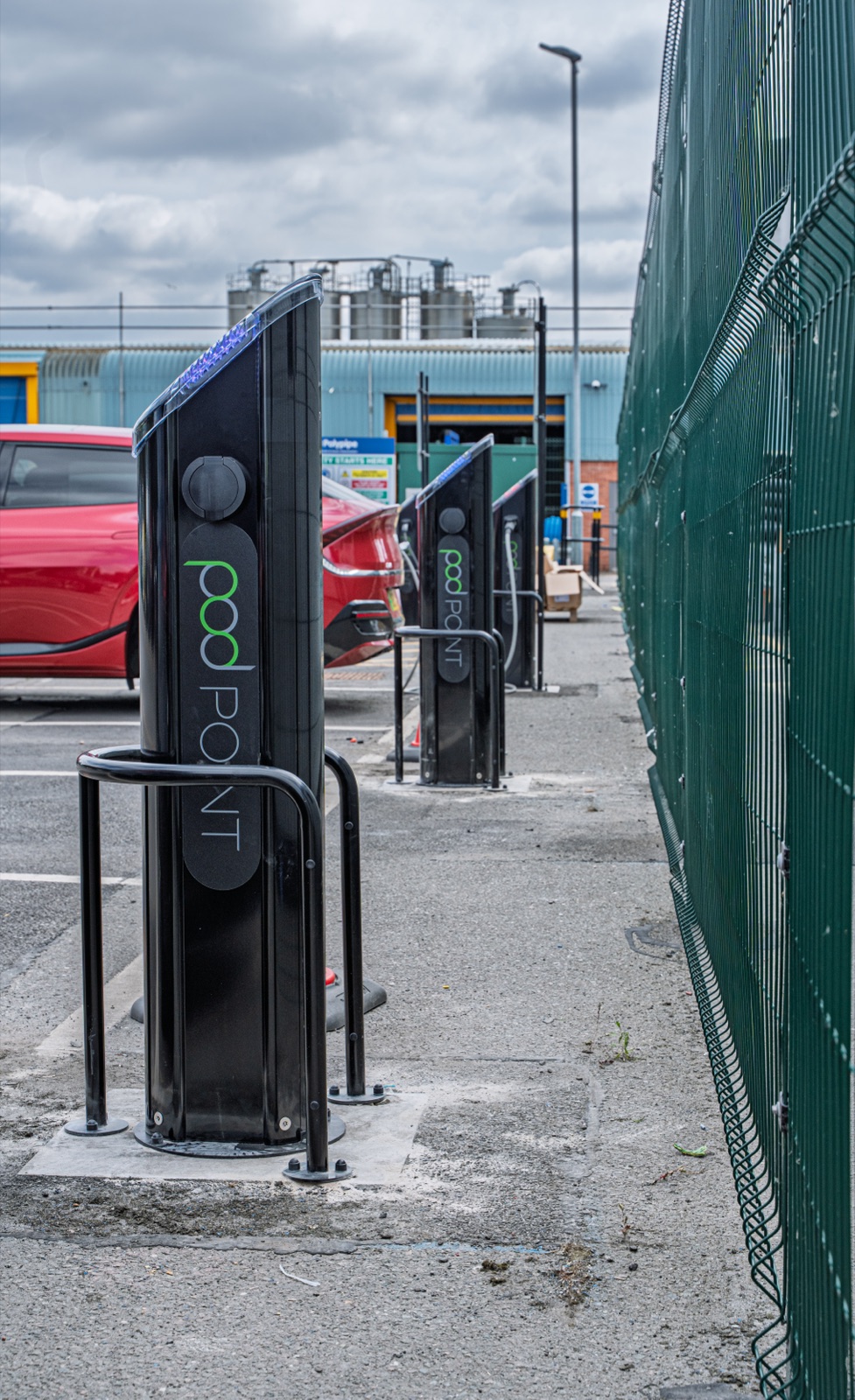 Two completed Pod Point chargers by the perimeter fence at Polypipe Horncastle