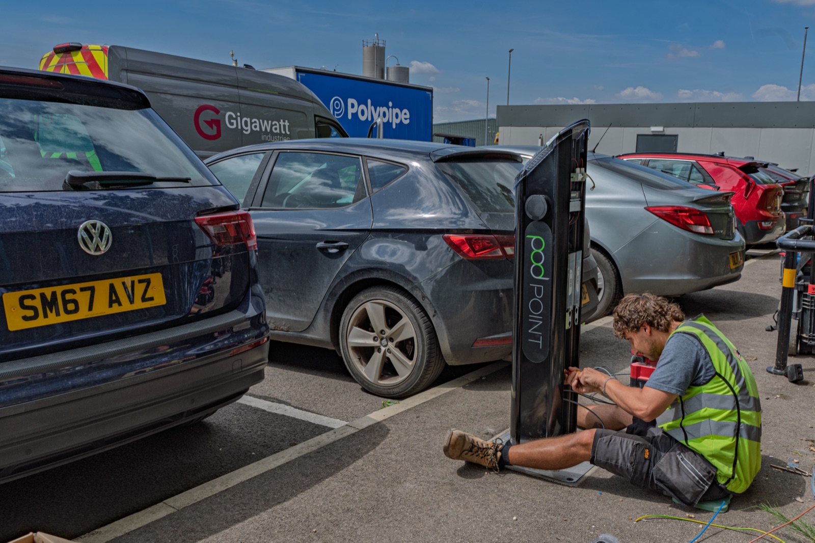 Pod Point charger install underway with Polypipe signage in the background